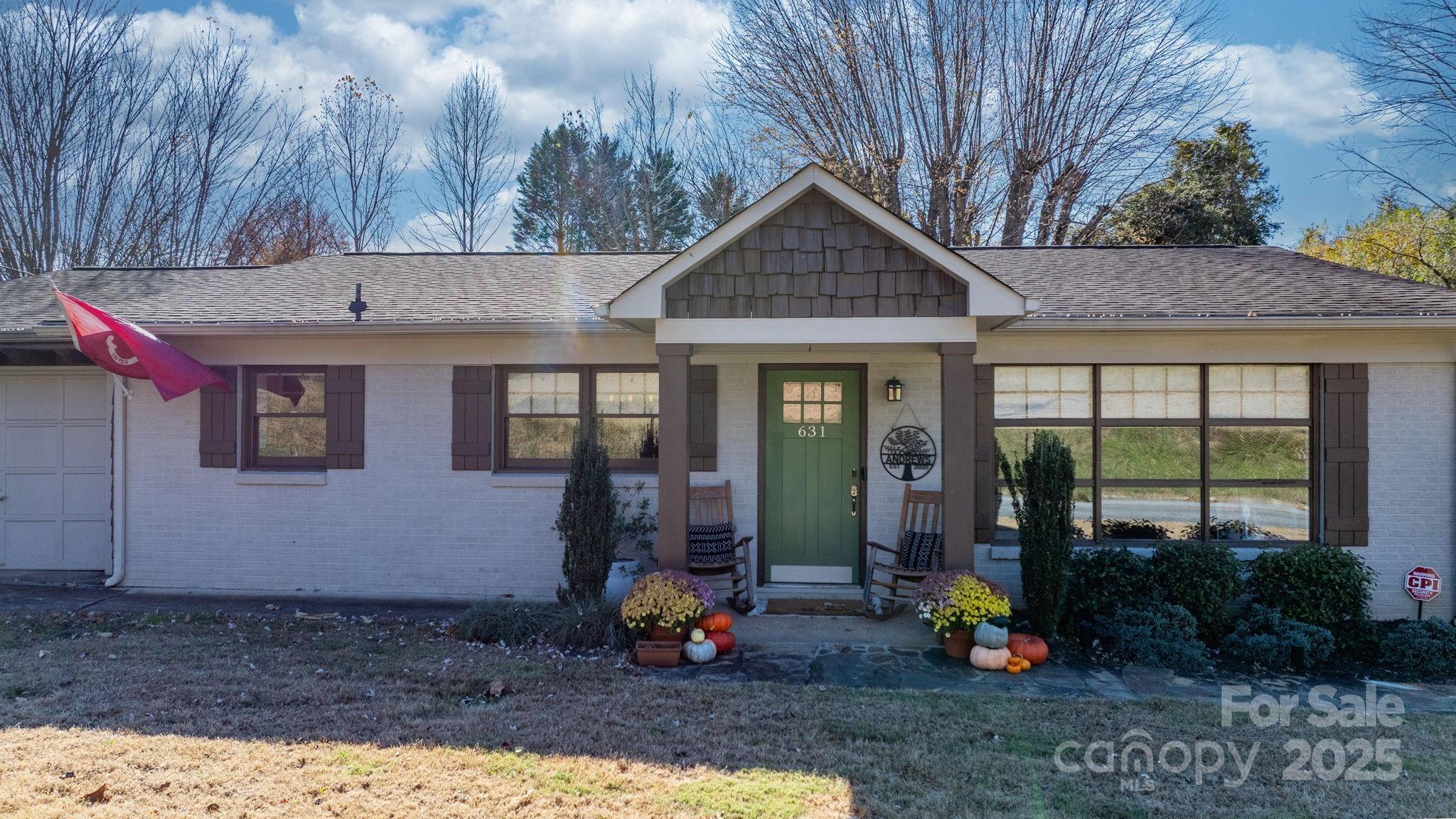 631 Powell Road Northeast Lenoir, NC 28645 - Photo 6 of 38 a front view of a house with garden