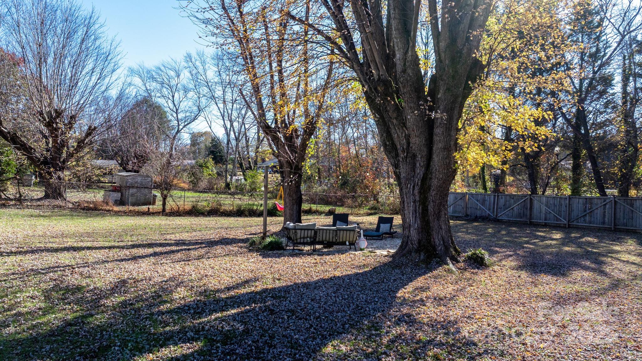 631 Powell Road Northeast Lenoir, NC 28645 - Photo 10 of 38 a view of a yard with large trees