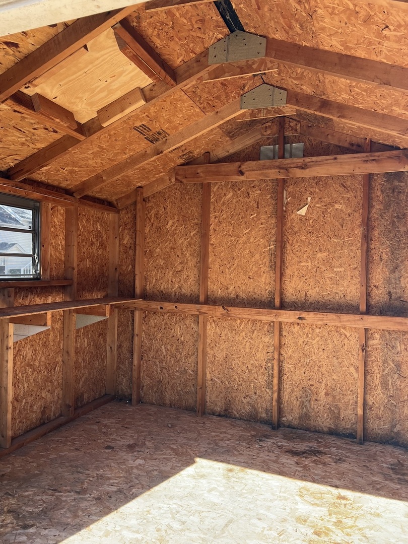 407 Abe Street Plano, IL 60545 - Photo 14 of 15 a view of a garage with wooden fence
