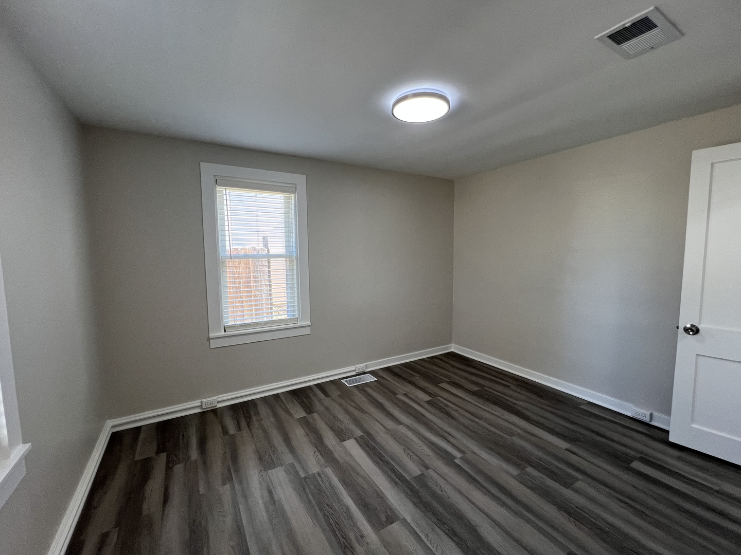 407 Abe Street Plano, IL 60545 - Photo 6 of 15 wooden floor in an empty room