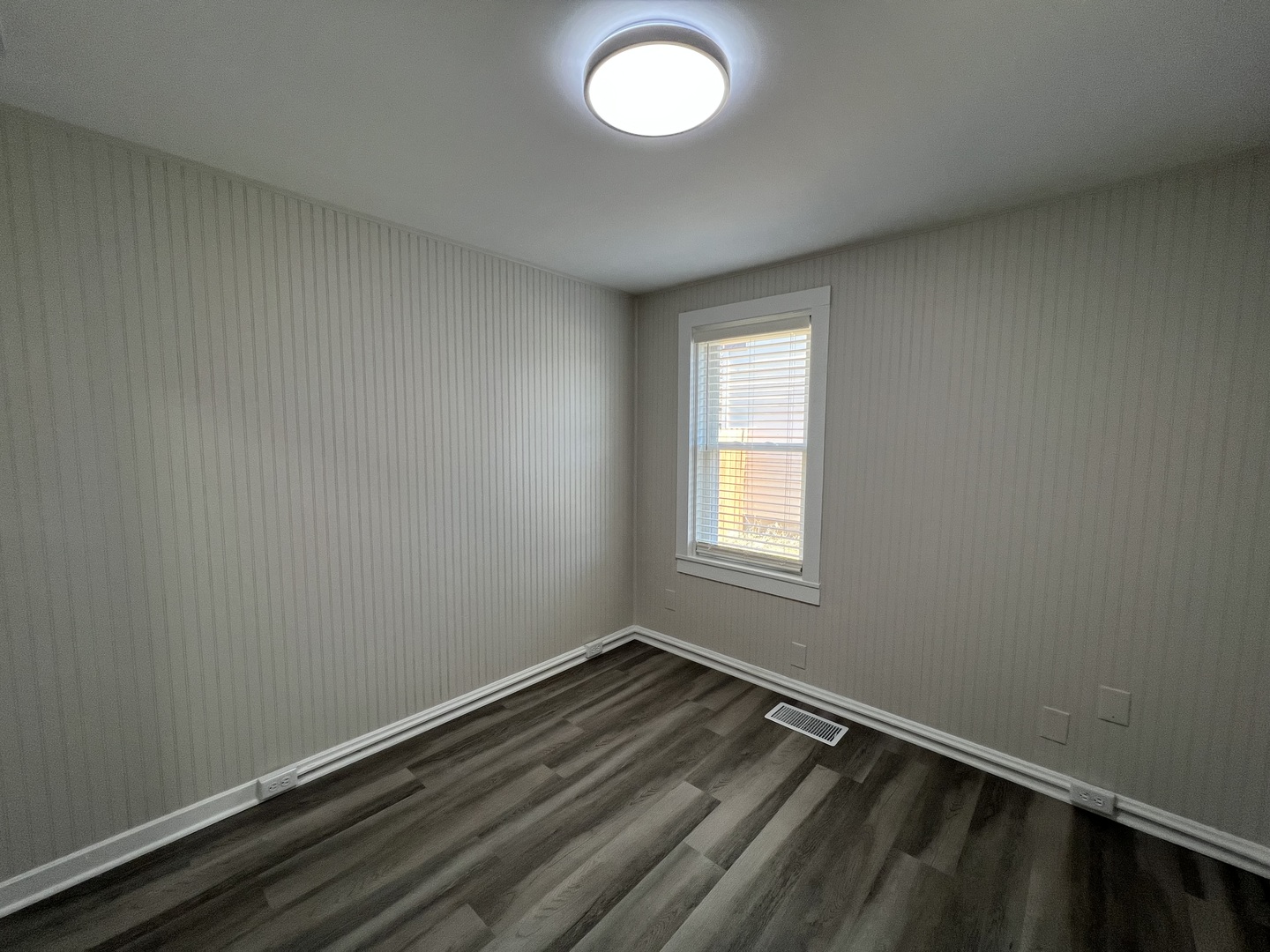 407 Abe Street Plano, IL 60545 - Photo 7 of 15 an empty room with a window