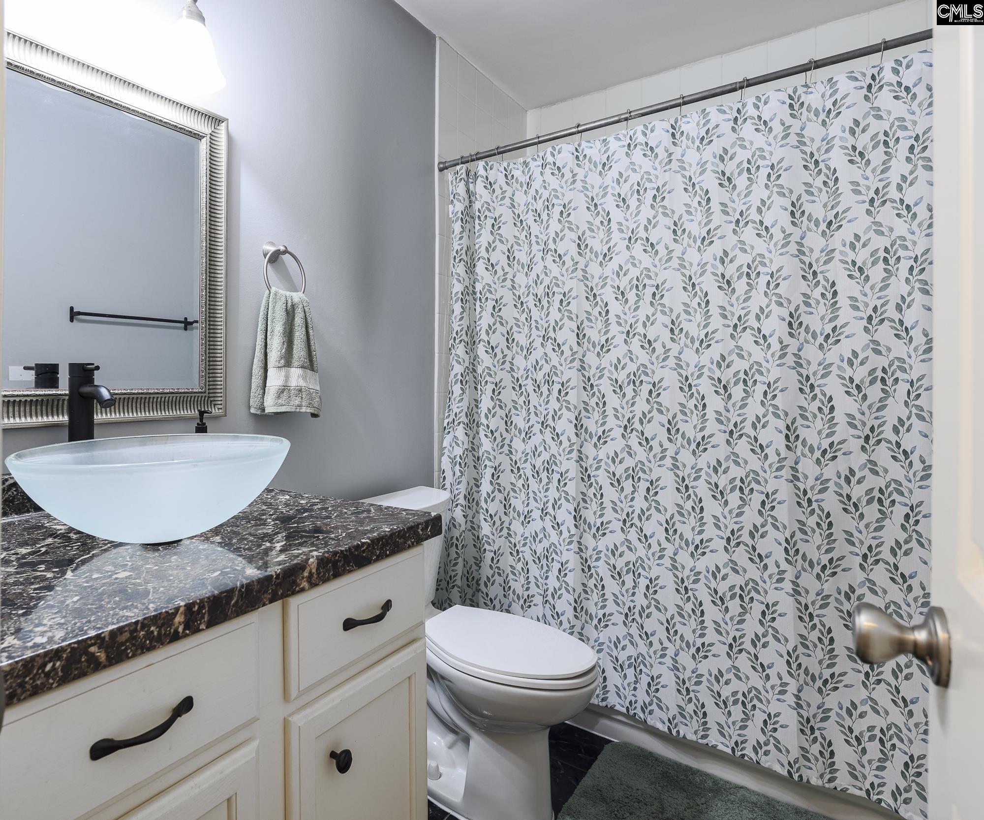 152 Thames Valley Court Irmo, SC 29063 - Photo 20 of 32 a bathroom with a granite countertop sink and a mirror