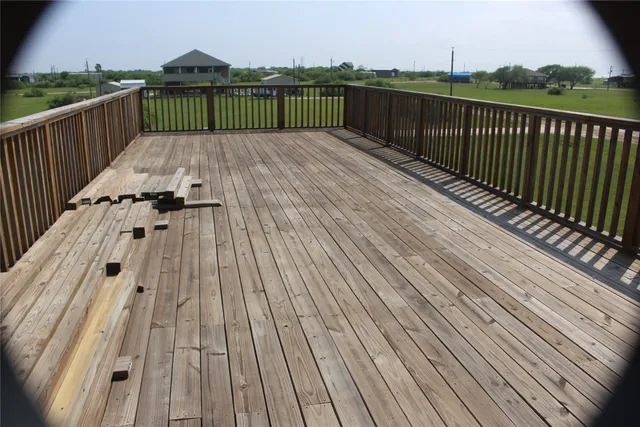 a view of balcony with wooden floor