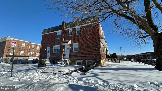 a view of a building with a yard