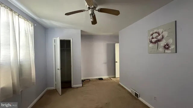 wooden floor in an empty room and a window