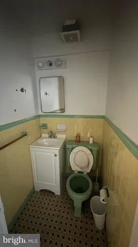 a bathroom with a sink toilet and vanity