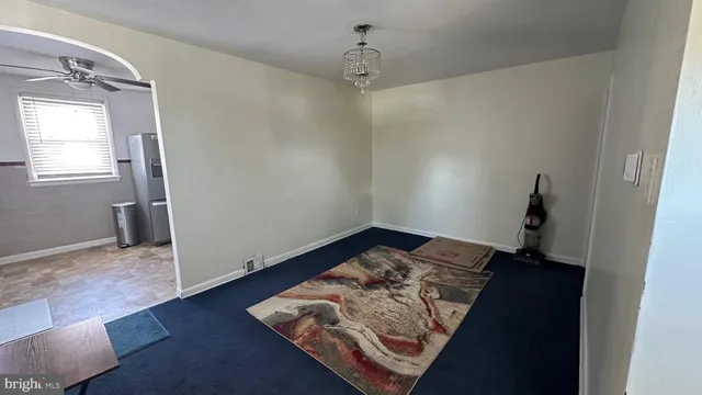 a view of a bedroom with wooden floor