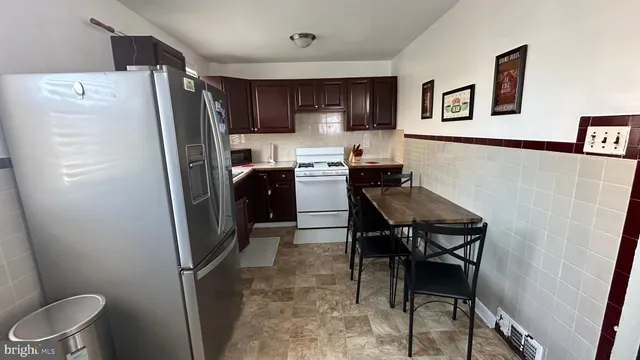 a kitchen with stainless steel appliances a refrigerator stove microwave and sink