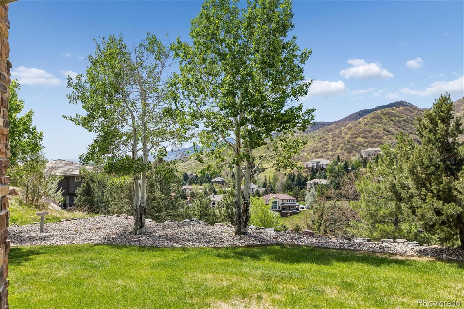 16422 Rocky Point Lane Morrison, CO 80465 - Photo 44 of 50 a view of a yard with table and chairs