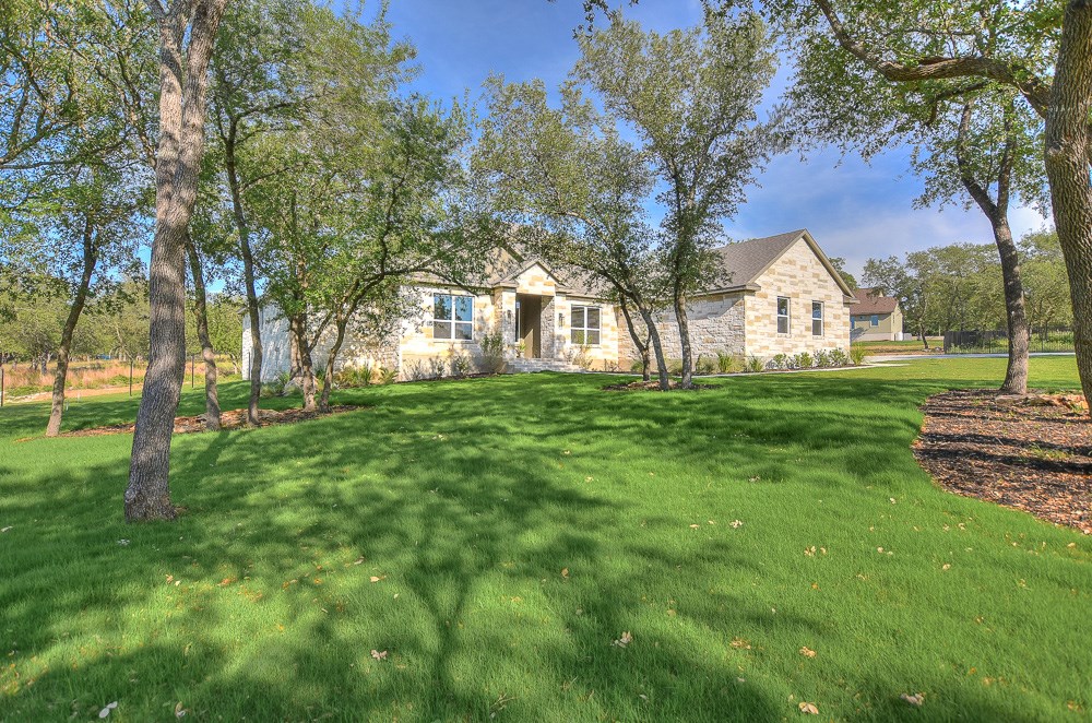 a view of a house with a big yard