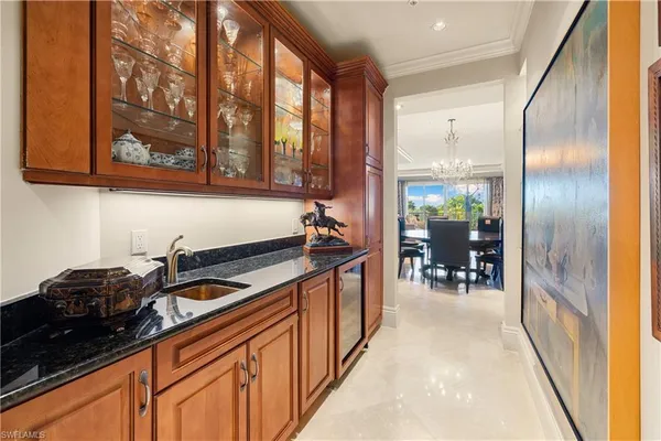 a kitchen with stainless steel appliances granite countertop sink stove top oven and cabinets