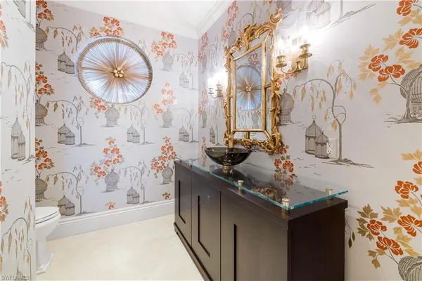 a bathroom with a sink vanity and a mirror