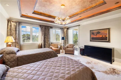 a bedroom with large bed and a window