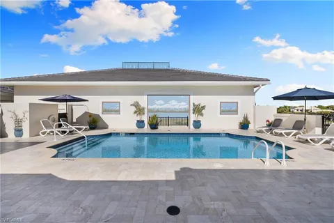 a view of a living room and kitchen