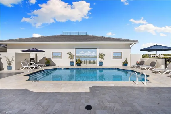 a view of a living room and kitchen