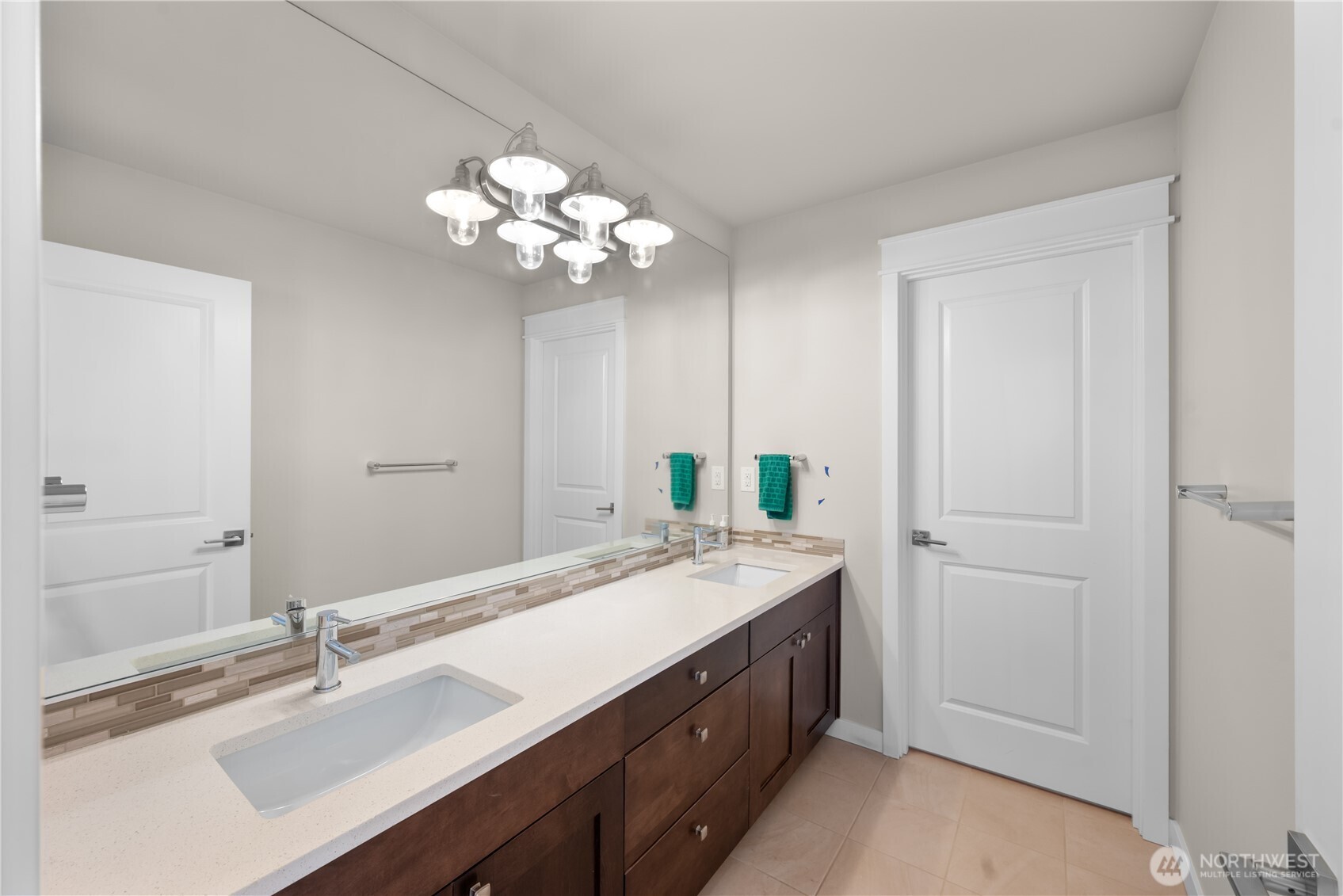 26925 230th Place Southeast Maple Valley, WA 98038 - Photo 19 of 32 a bathroom with a sink vanity and a mirror