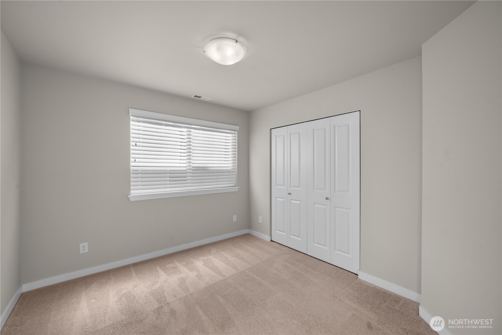 26925 230th Place Southeast Maple Valley, WA 98038 - Photo 21 of 32 a view of an empty room with a window