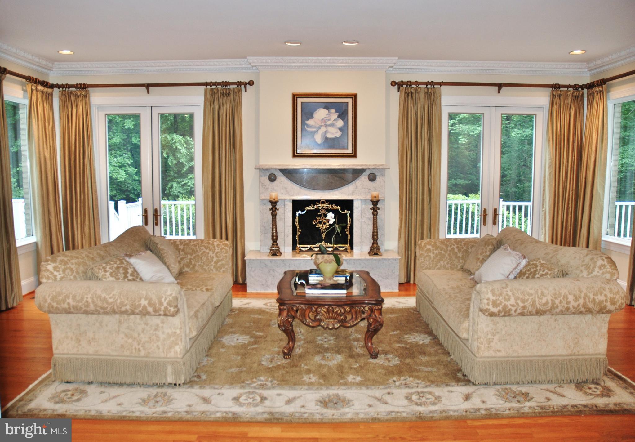 11548 Springridge Road Potomac, MD 20854 - Photo 11 of 30 a living room with furniture and a fireplace