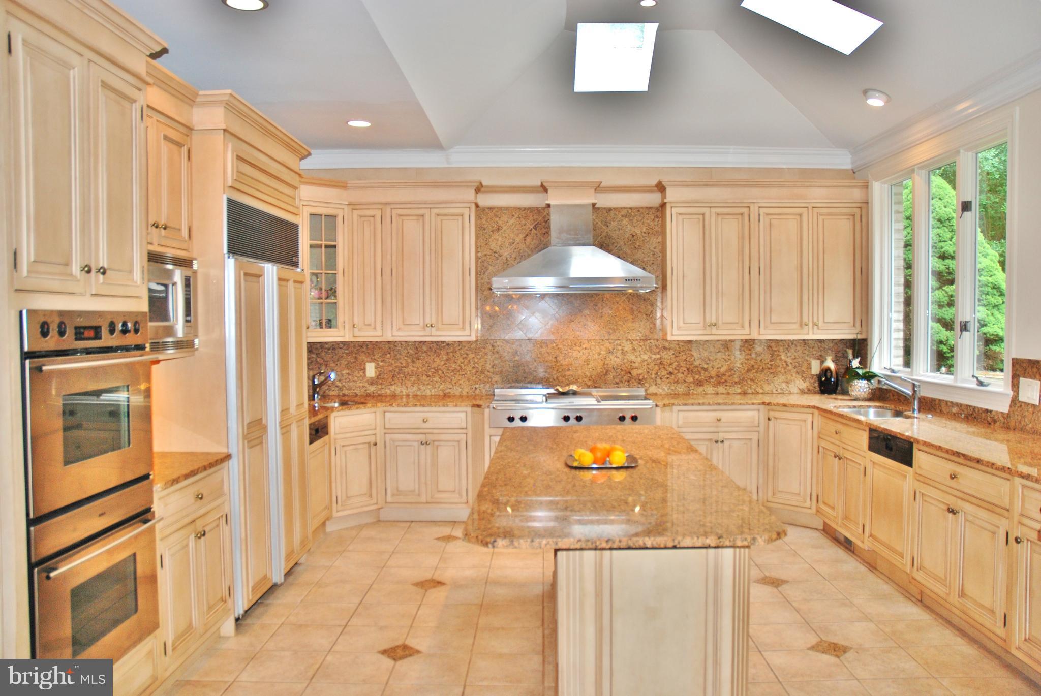 11548 Springridge Road Potomac, MD 20854 - Photo 13 of 30 a large kitchen with granite countertop a large window and a counter space