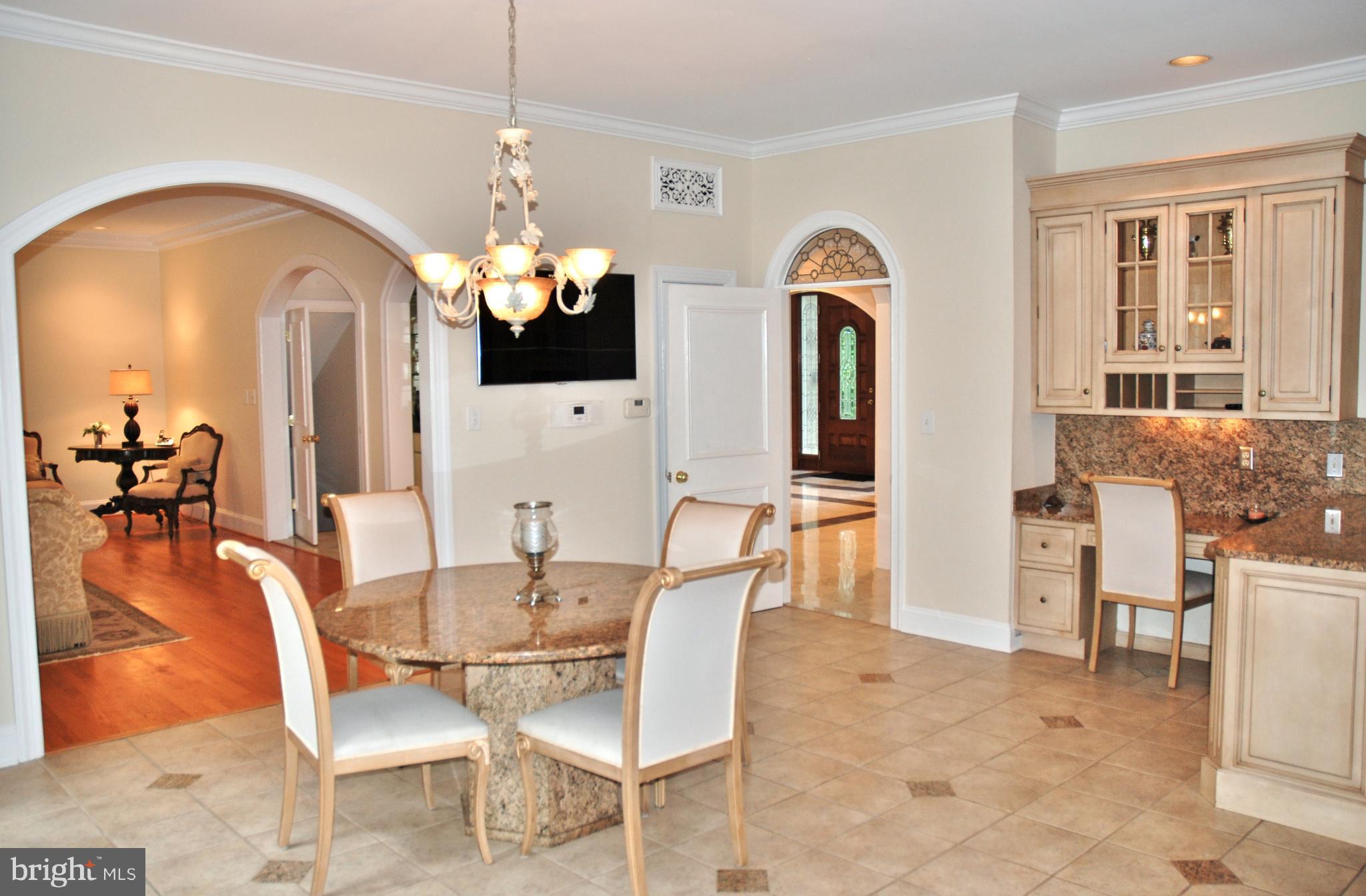11548 Springridge Road Potomac, MD 20854 - Photo 14 of 30 a view of a dining room with furniture