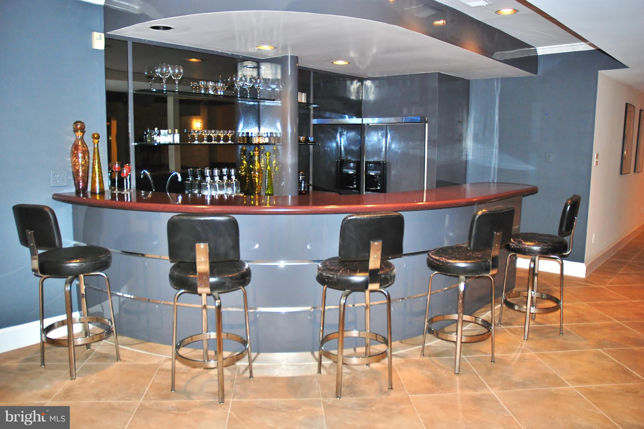 11548 Springridge Road Potomac, MD 20854 - Photo 21 of 30 a room with lots of chairs and mirrors