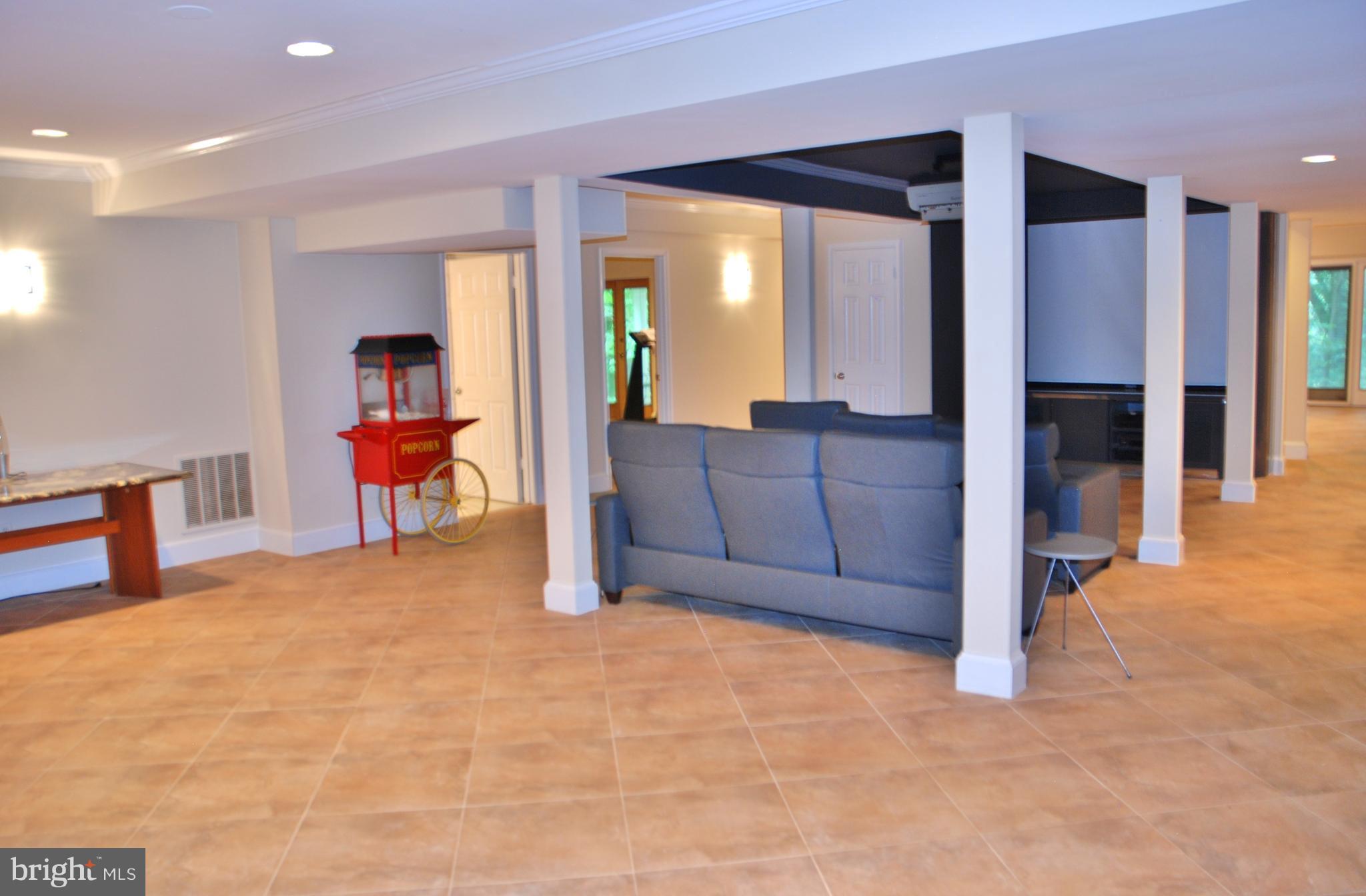 11548 Springridge Road Potomac, MD 20854 - Photo 22 of 30 a living room with furniture and a large window