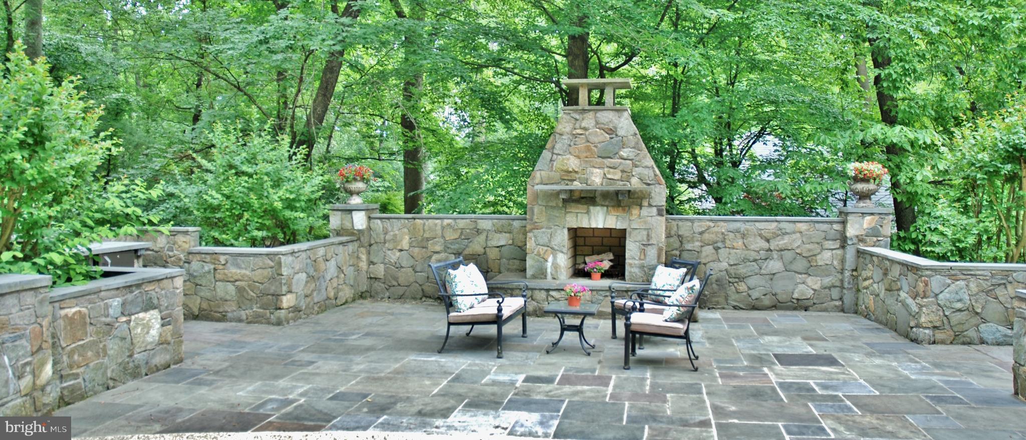 11548 Springridge Road Potomac, MD 20854 - Photo 25 of 30 a view of a patio with table and chairs and potted plants