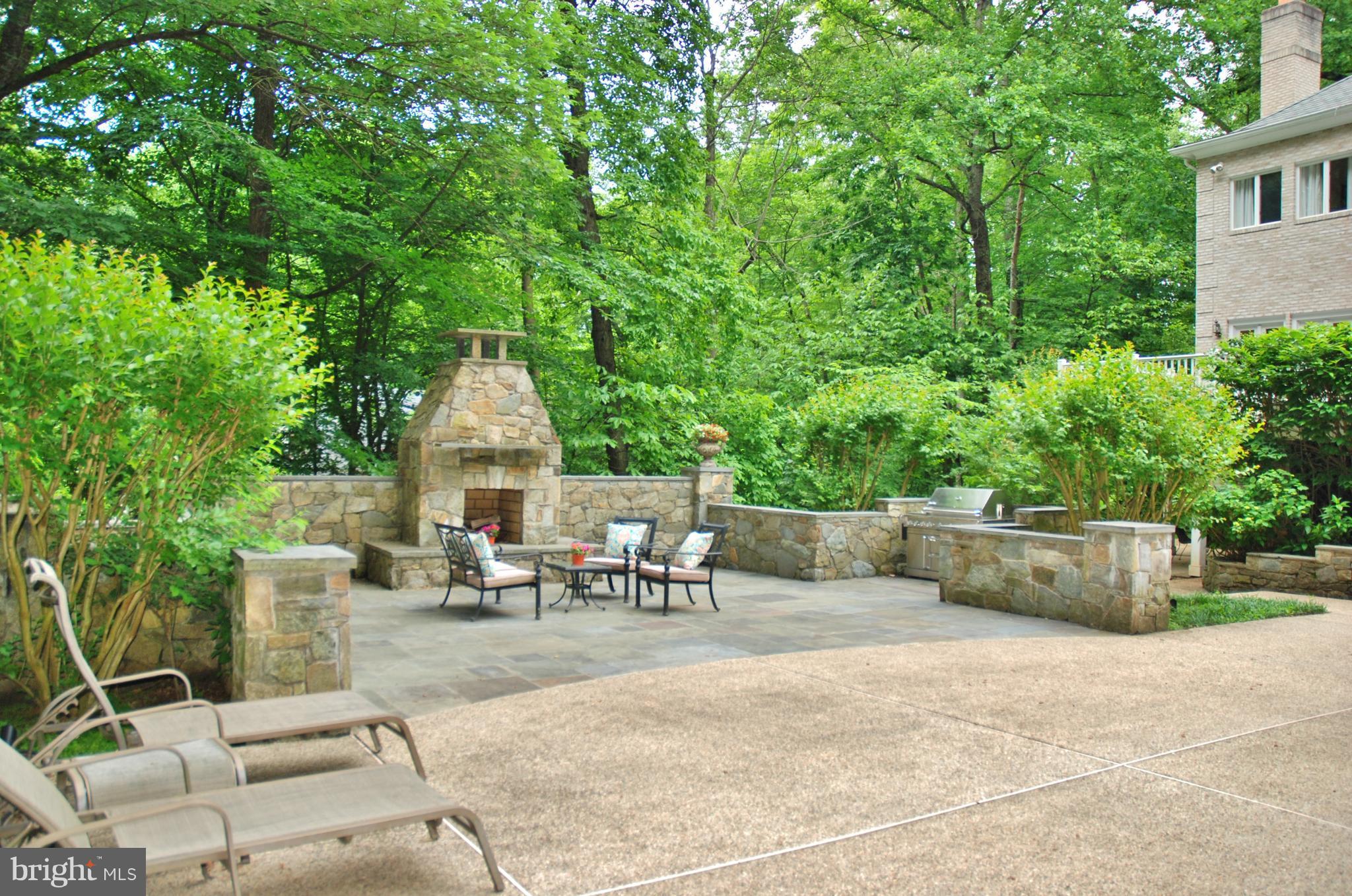 11548 Springridge Road Potomac, MD 20854 - Photo 26 of 30 a view of patio with table and chairs potted plants and large tree