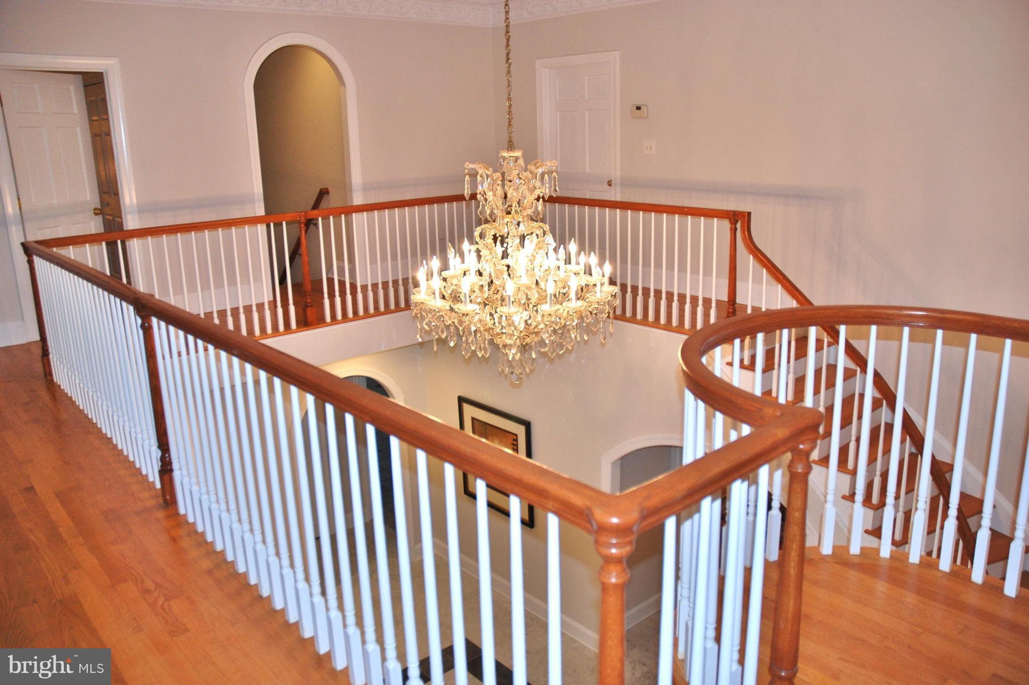 11548 Springridge Road Potomac, MD 20854 - Photo 8 of 30 a view of entryway and hall with wooden floor