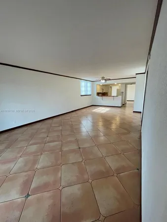 a view of a refrigerator in a kitchen