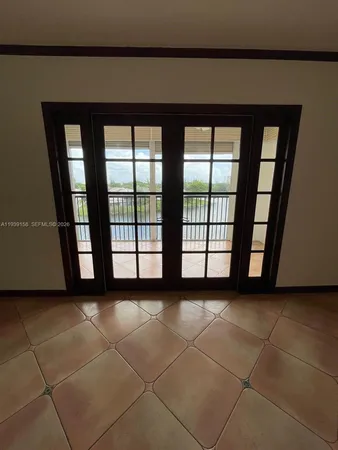 a view of a big room with windows and wardrobe