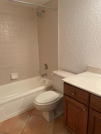 a bathroom with a toilet a sink and a bathtub