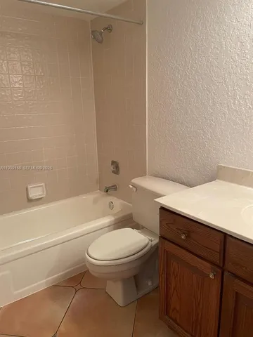 a bathroom with a toilet a sink and a bathtub