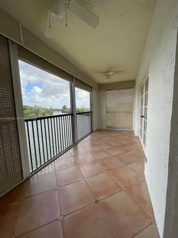 a view of a hallway with a porch