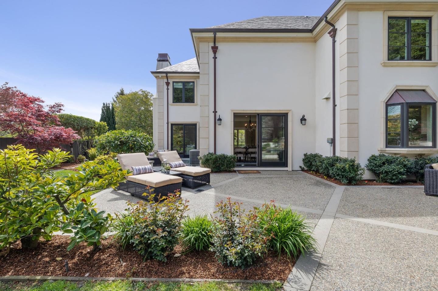 138 Stonepine Road Hillsborough, CA 94010 - Photo 13 of 119 a view of a patio with couches table and chairs and potted plants