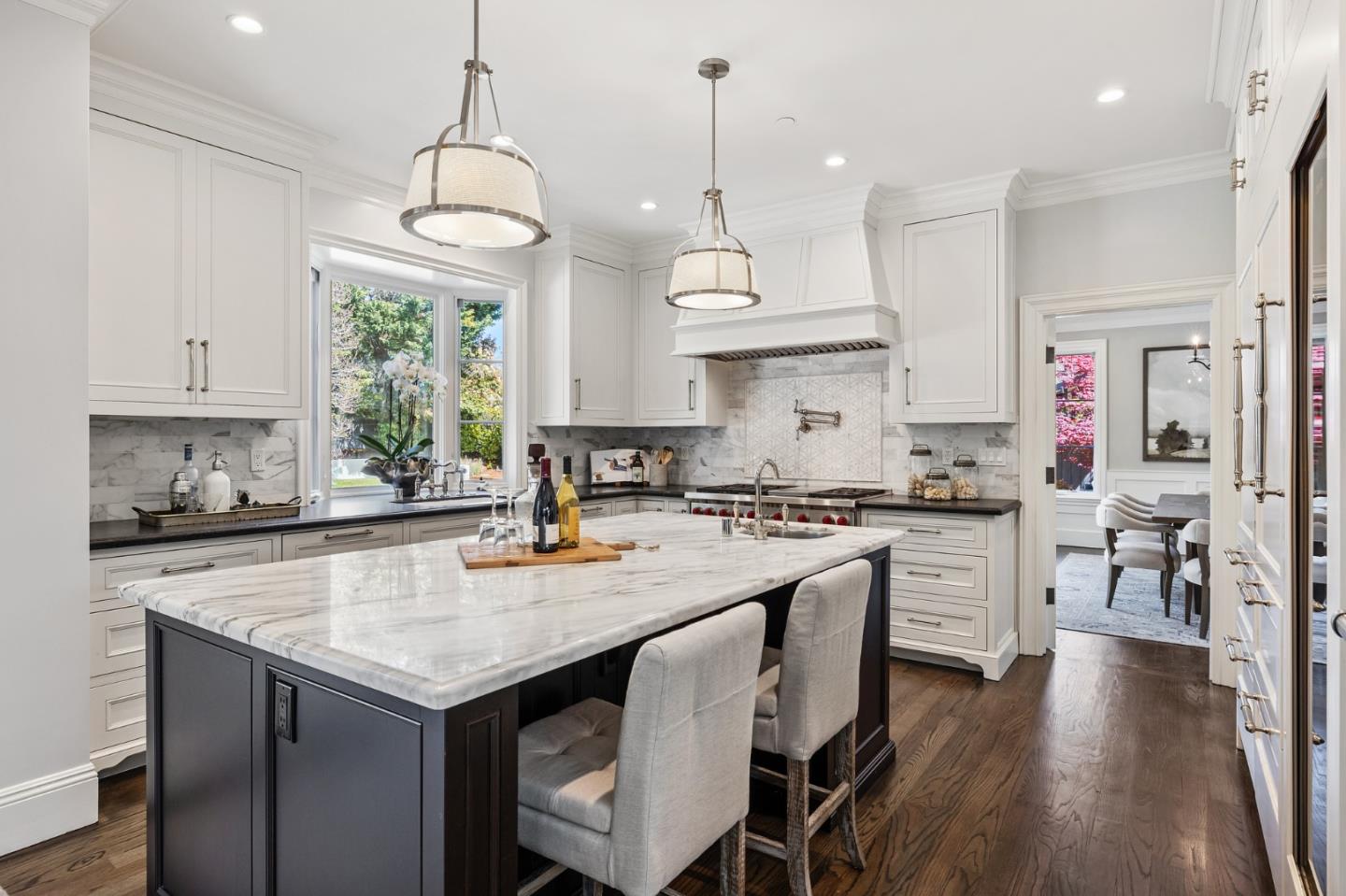 138 Stonepine Road Hillsborough, CA 94010 - Photo 17 of 119 a kitchen with granite countertop a stove a sink a center island and wooden floor