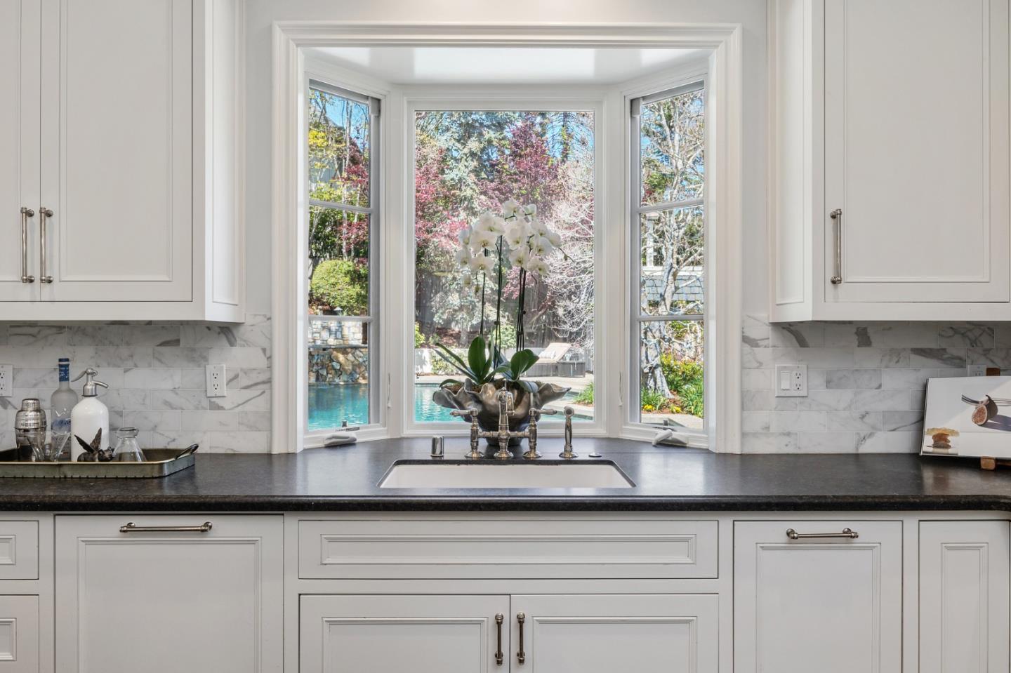 138 Stonepine Road Hillsborough, CA 94010 - Photo 19 of 119 a kitchen with granite countertop stainless steel appliances white cabinets and a window