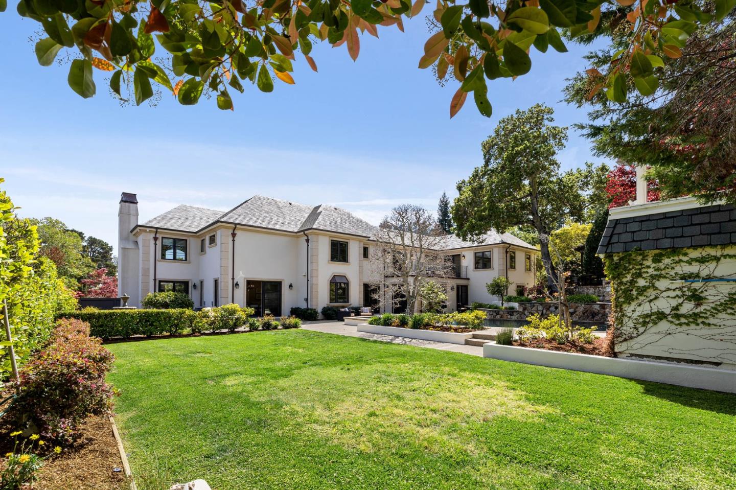 138 Stonepine Road Hillsborough, CA 94010 - Photo 81 of 119 a front view of a house with a garden and trees