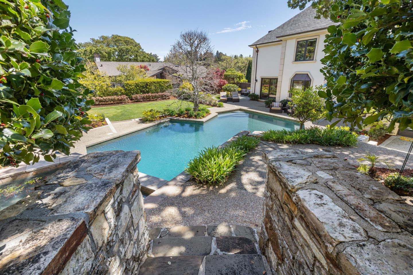 138 Stonepine Road Hillsborough, CA 94010 - Photo 89 of 119 a view of a house with a yard and a pond