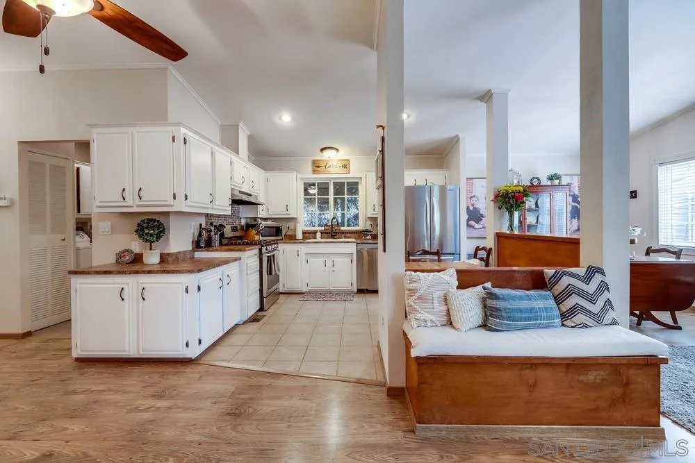 9036 Lemon Avenue La Mesa, CA 91941 - Photo 13 of 28 a large white kitchen with cabinets