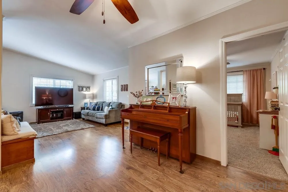 9036 Lemon Avenue La Mesa, CA 91941 - Photo 16 of 28 a living room with furniture a flat screen tv and a dining table