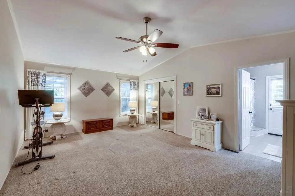 9036 Lemon Avenue La Mesa, CA 91941 - Photo 18 of 28 a view of a livingroom with furniture and a ceiling fan