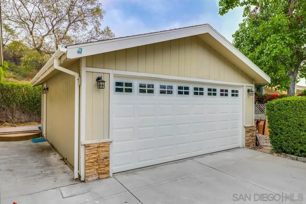 9036 Lemon Avenue La Mesa, CA 91941 - Photo 28 of 28 a front view of a house with parking area