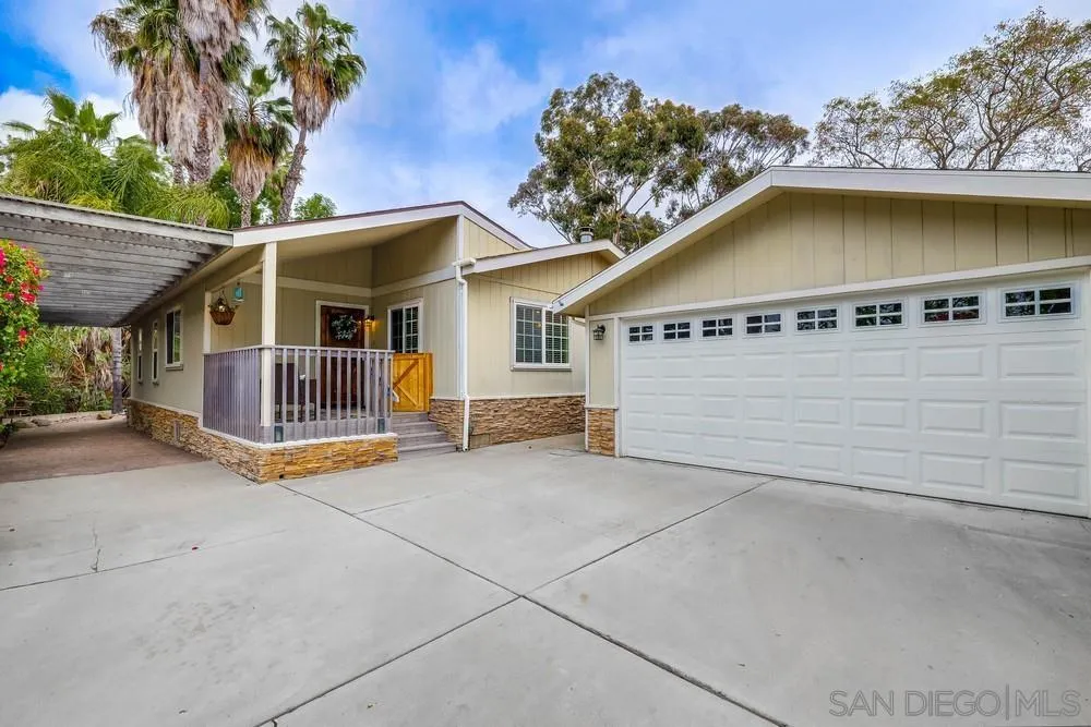 9036 Lemon Avenue La Mesa, CA 91941 - Photo 3 of 28 a view of a house with a patio and a yard