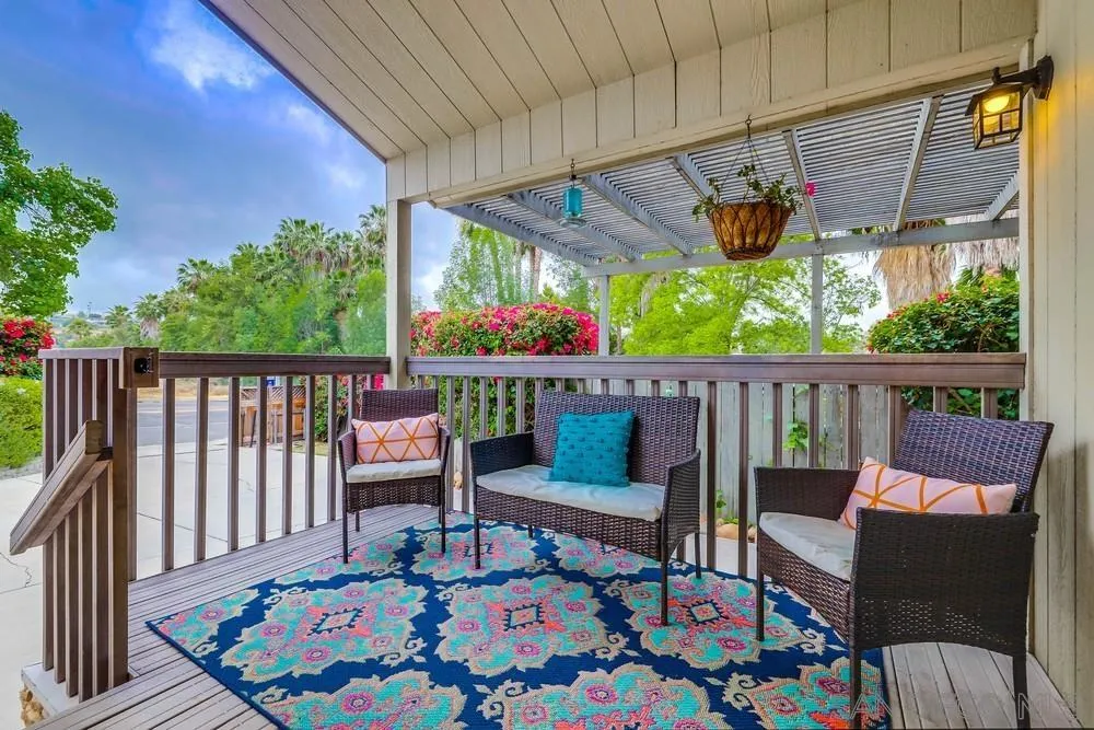 9036 Lemon Avenue La Mesa, CA 91941 - Photo 4 of 28 a roof deck with table and chairs and potted plants
