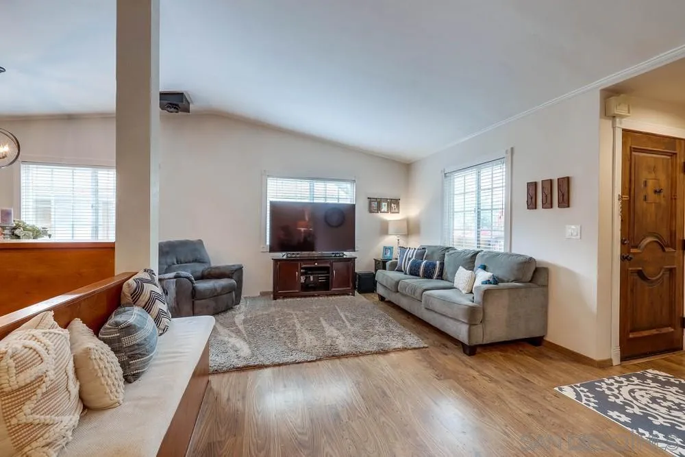 9036 Lemon Avenue La Mesa, CA 91941 - Photo 7 of 28 a living room with furniture and a flat screen tv