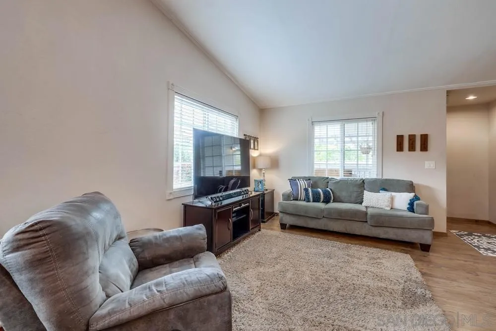 9036 Lemon Avenue La Mesa, CA 91941 - Photo 8 of 28 a living room with furniture and a flat screen tv