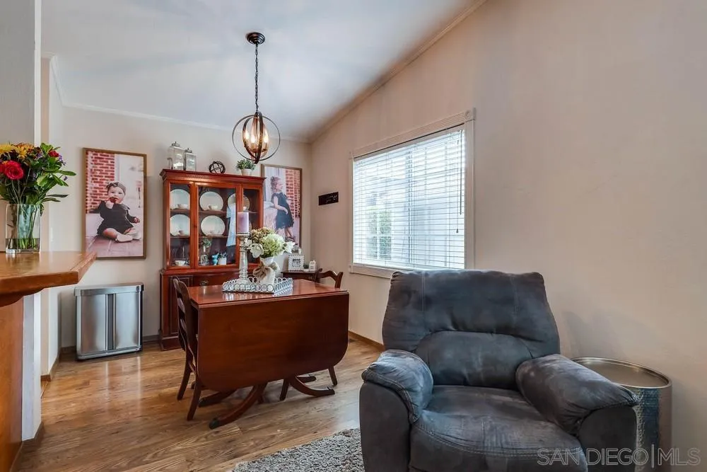 9036 Lemon Avenue La Mesa, CA 91941 - Photo 9 of 28 a living room with furniture a chandelier and a window