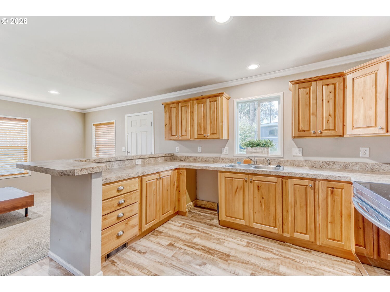 4264 Southeast 122nd Avenue, Unit 13 Portland, OR 97236 - Photo 11 of 30 a kitchen with granite countertop a sink cabinets and window