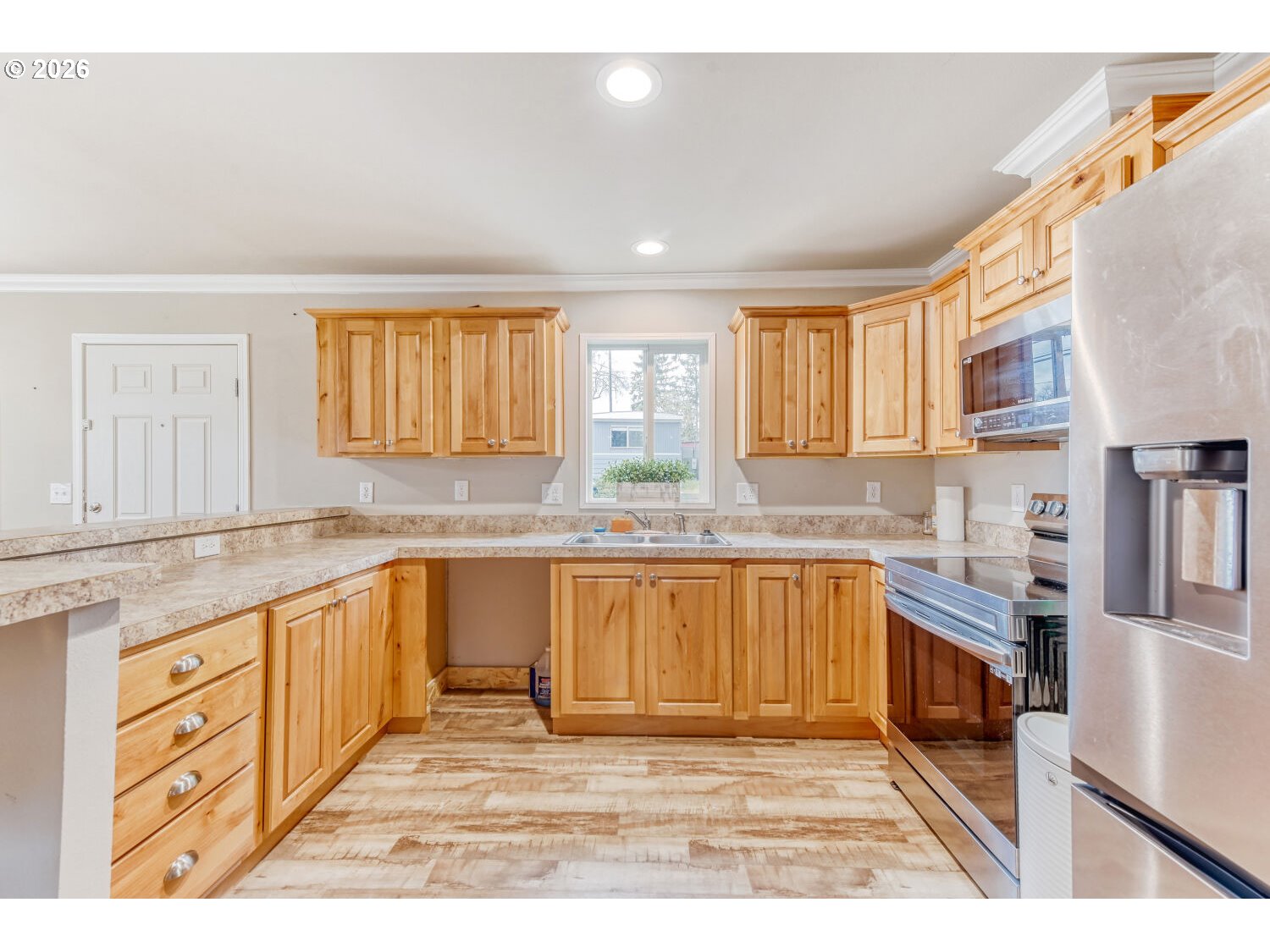 4264 Southeast 122nd Avenue, Unit 13 Portland, OR 97236 - Photo 12 of 30 a kitchen with stainless steel appliances granite countertop a sink and cabinets
